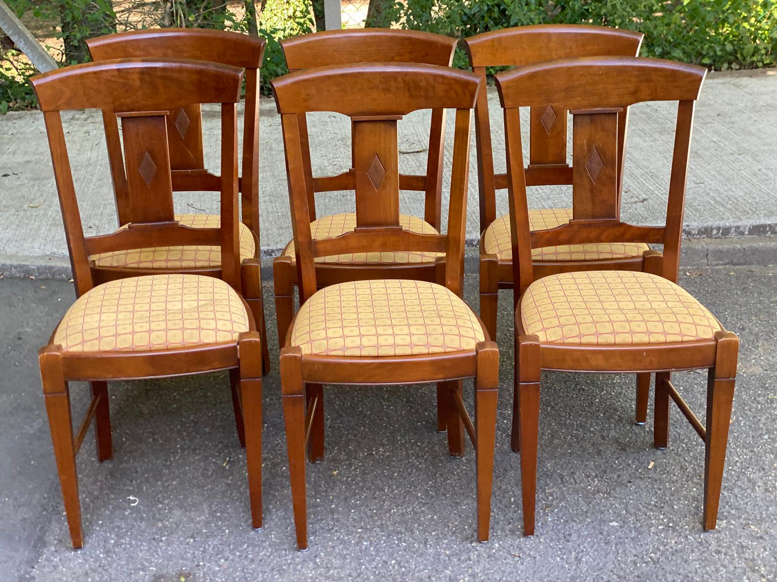 6 Syriel solid cherry wood dining chairs with yellow fabric.