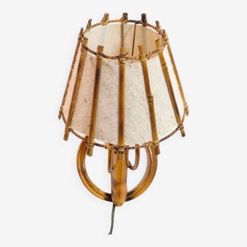 Small rattan wall lamp and its fabric lampshade from the 50s.