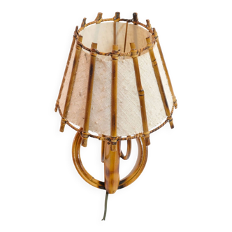 Small rattan wall lamp and its fabric lampshade from the 50s.