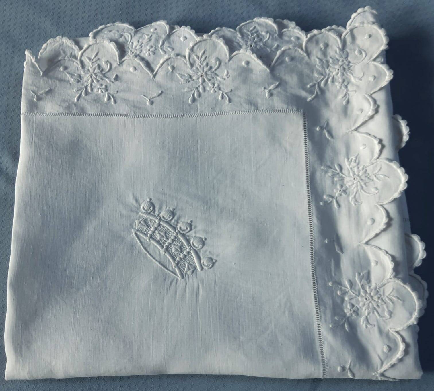 scalloped pillowcase decorated with a baron's crown