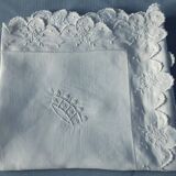 scalloped pillowcase decorated with a baron's crown