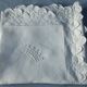 scalloped pillowcase decorated with a baron's crown