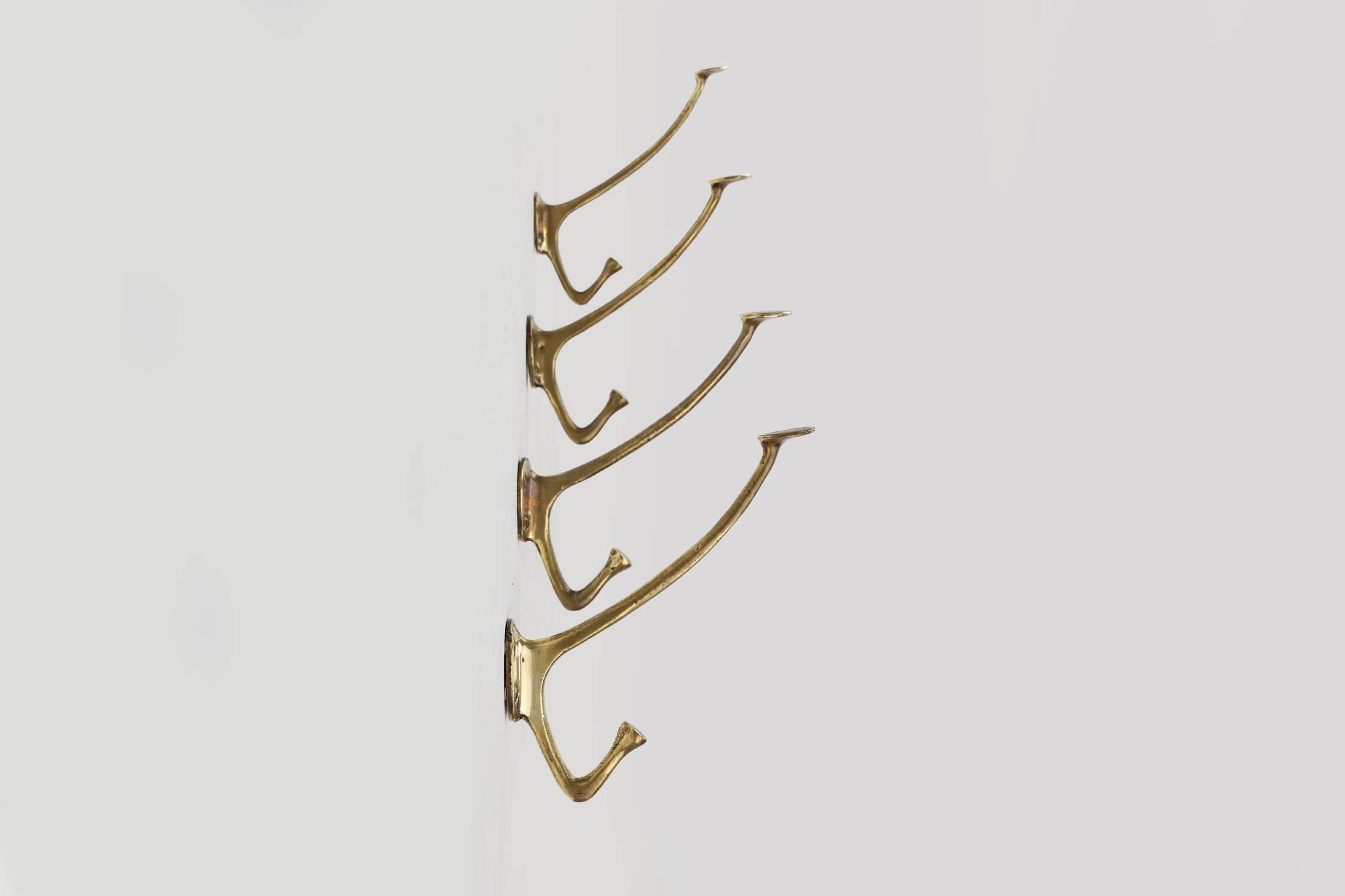 Set of 4 Adolf Loos brass art nouveau wall hooks, Vienna, Austria ca. 1910