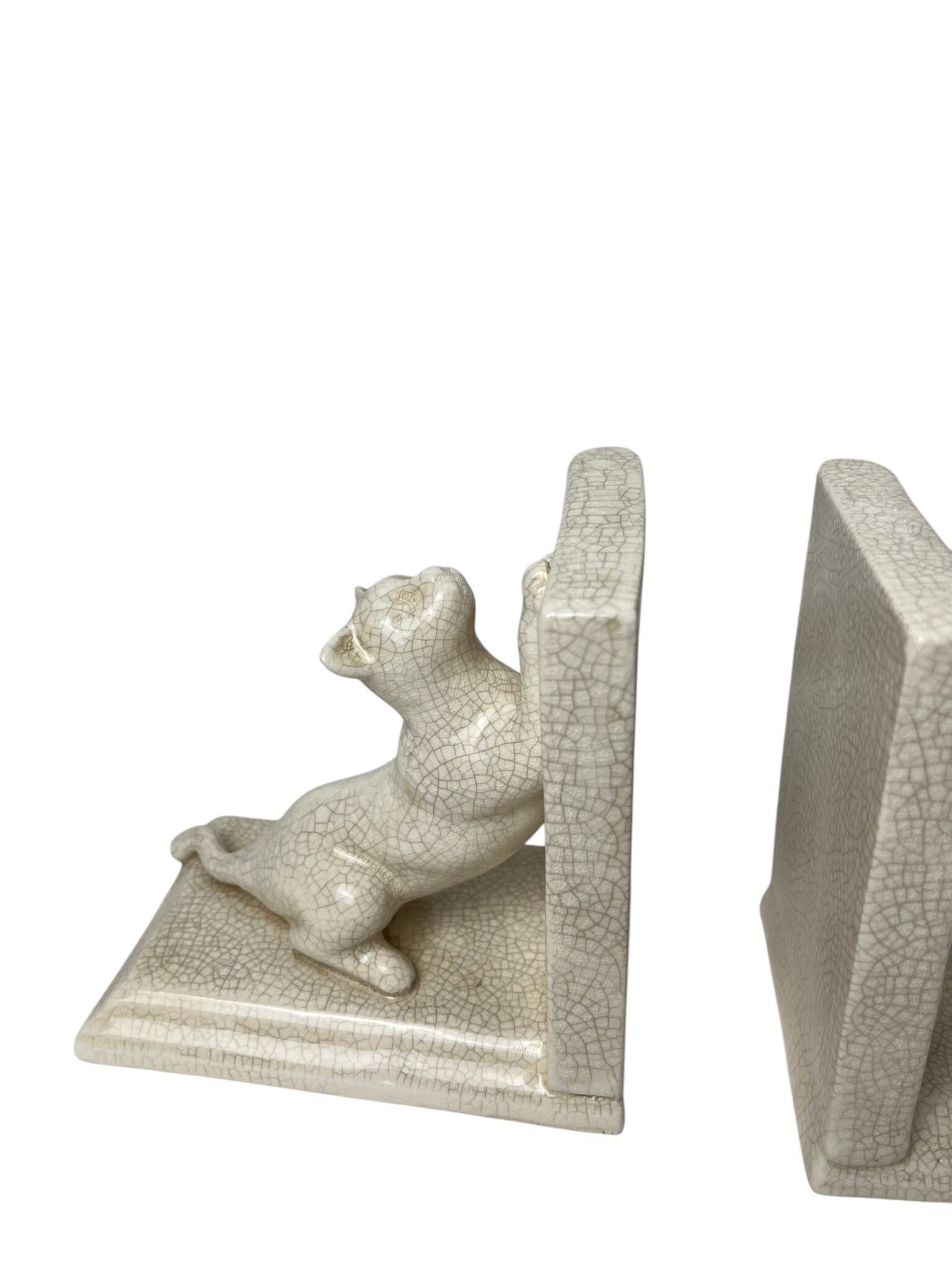 Art Deco, pair of crackled earthenware bookends featuring cats from Louvière around 1930.