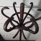 Curved antique wooden parrot