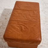 Ottoman with leather upholstery