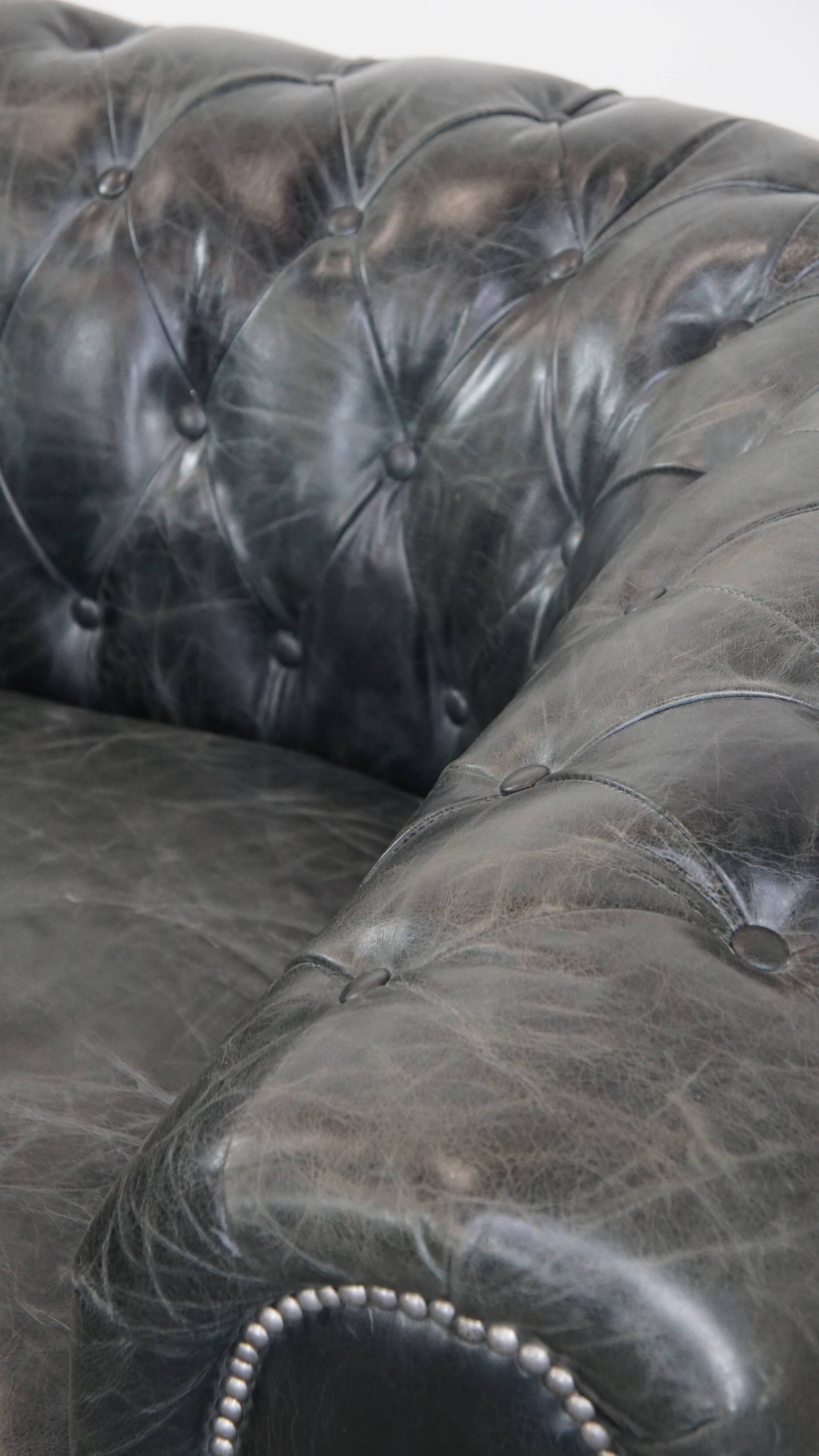 Black cowhide leather chesterfield armchair