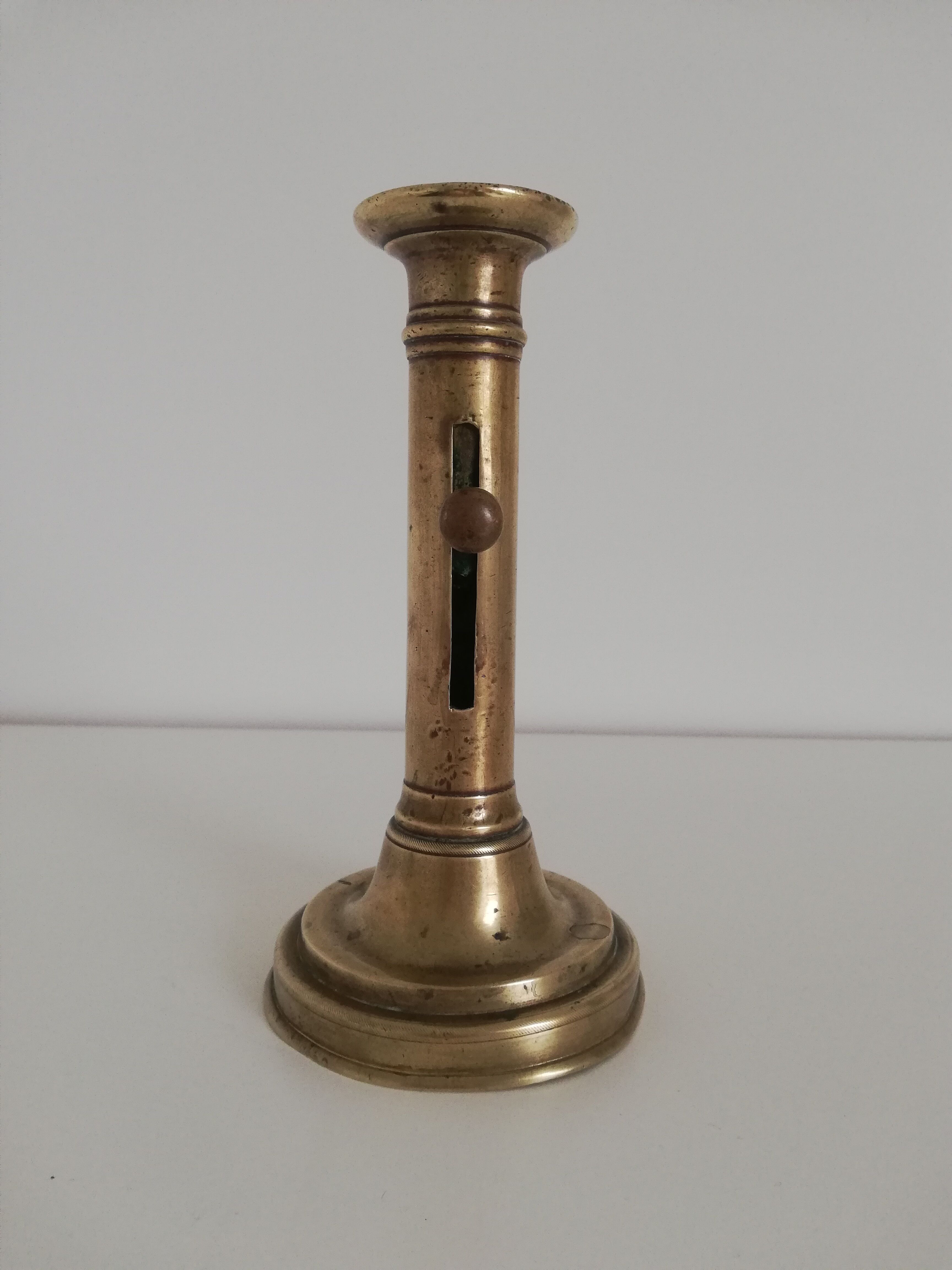 Vintage push candle holder