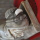Book-clamps couple of realistic old men in plaster