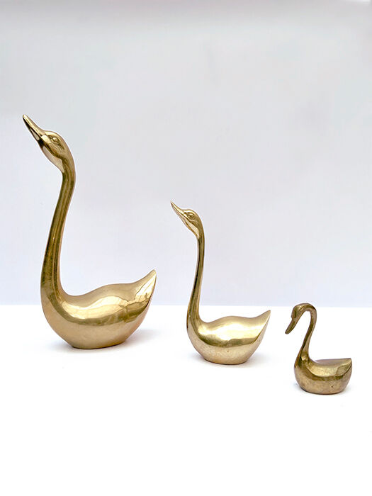 3 golden decorative swans