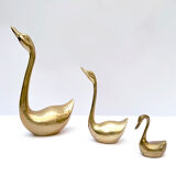 3 golden decorative swans