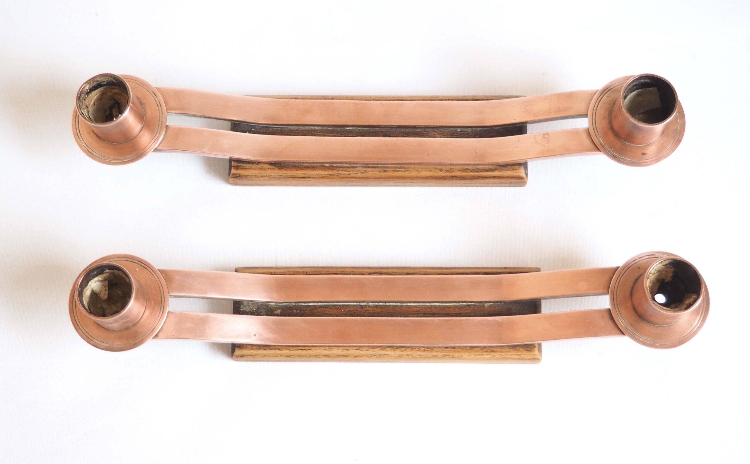 Pair of oak and copper bronze candlesticks