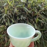 Set of green opaline cups