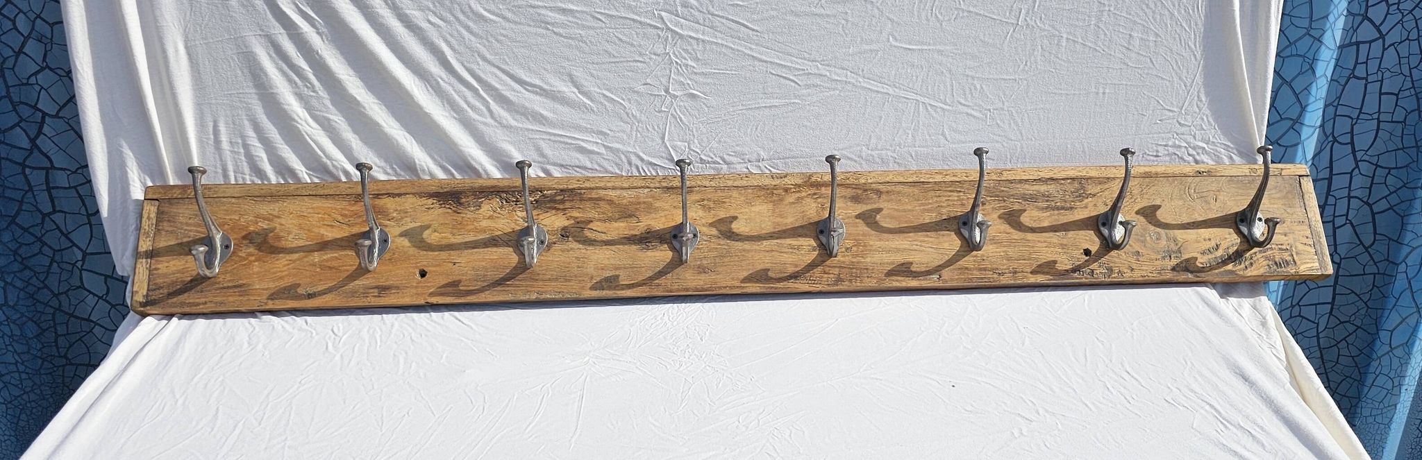 Teak coat rack with 8 double cast iron hooks
