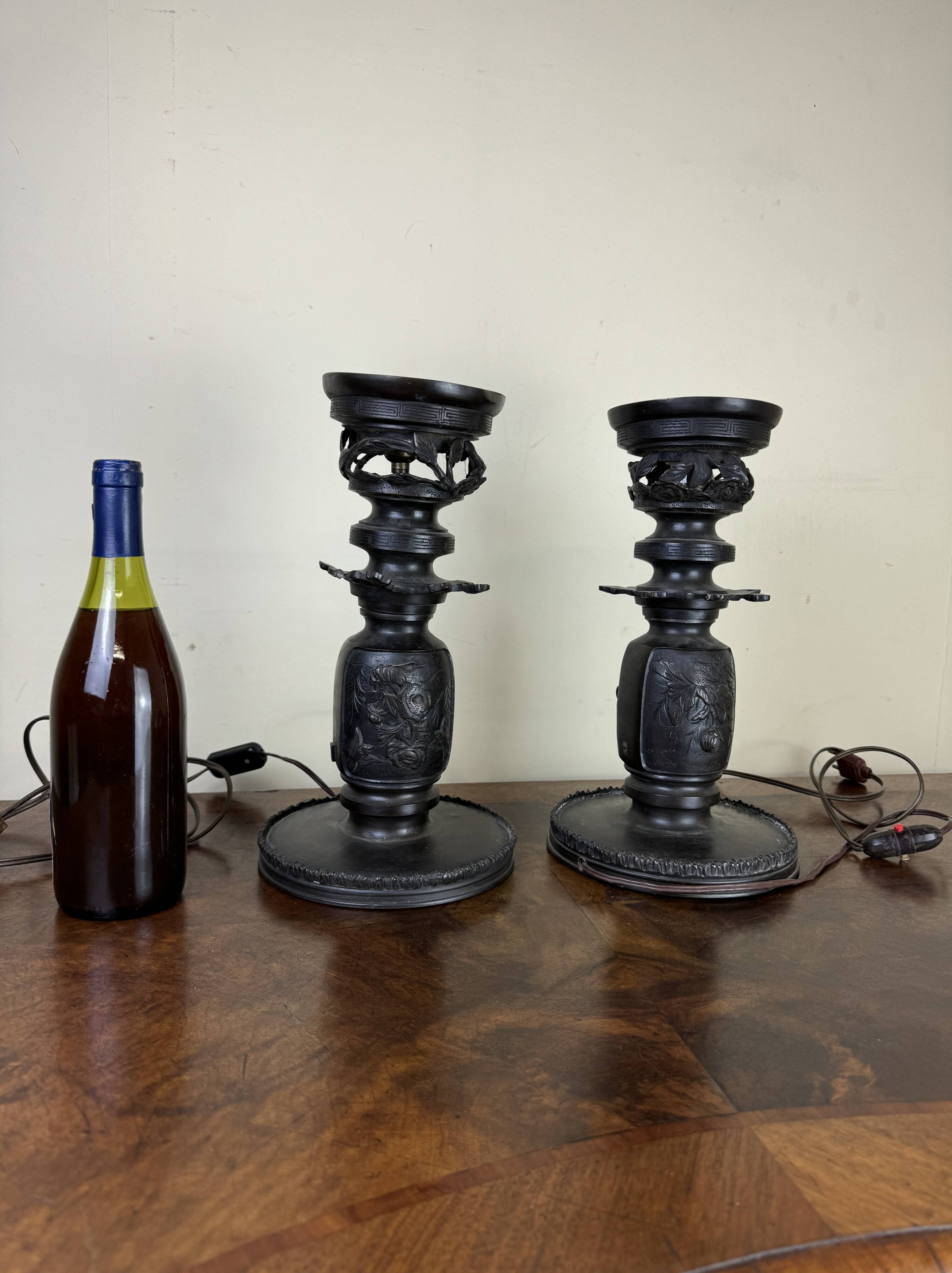 Japan Meiji period: Pair of patinated bronze candlesticks circa 1880