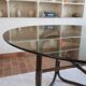 Round dining table in rattan, smoked glass top, 1970s.