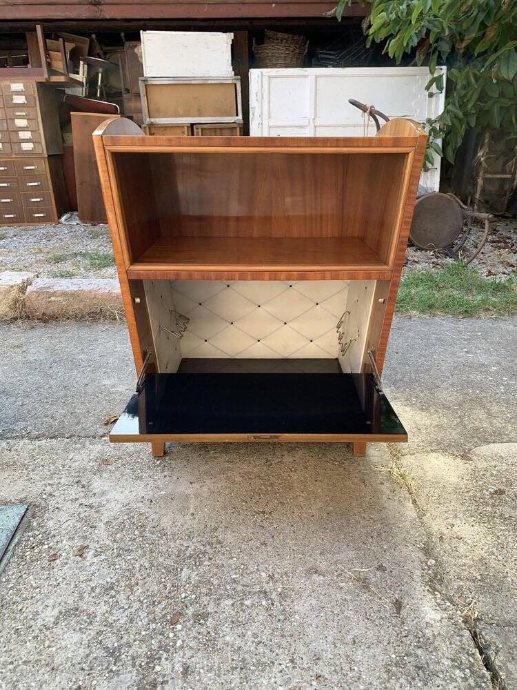 Brown trapezoidal wooden bar cabinet from the 1960s with a niche and lockable flap.