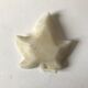Empty pocket in the shape of alabaster ivy leaves