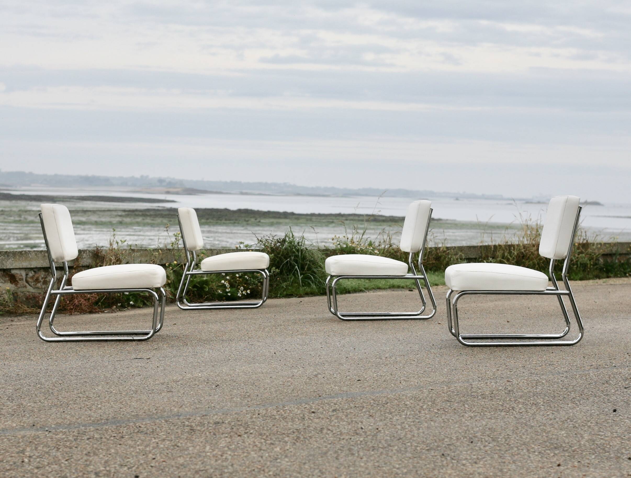 4 armchairs forming a modular sofa. Steel, imitation leather, 70s