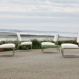 4 chauffeuses formant canapé modulable. acier, simili-cuir, années 70