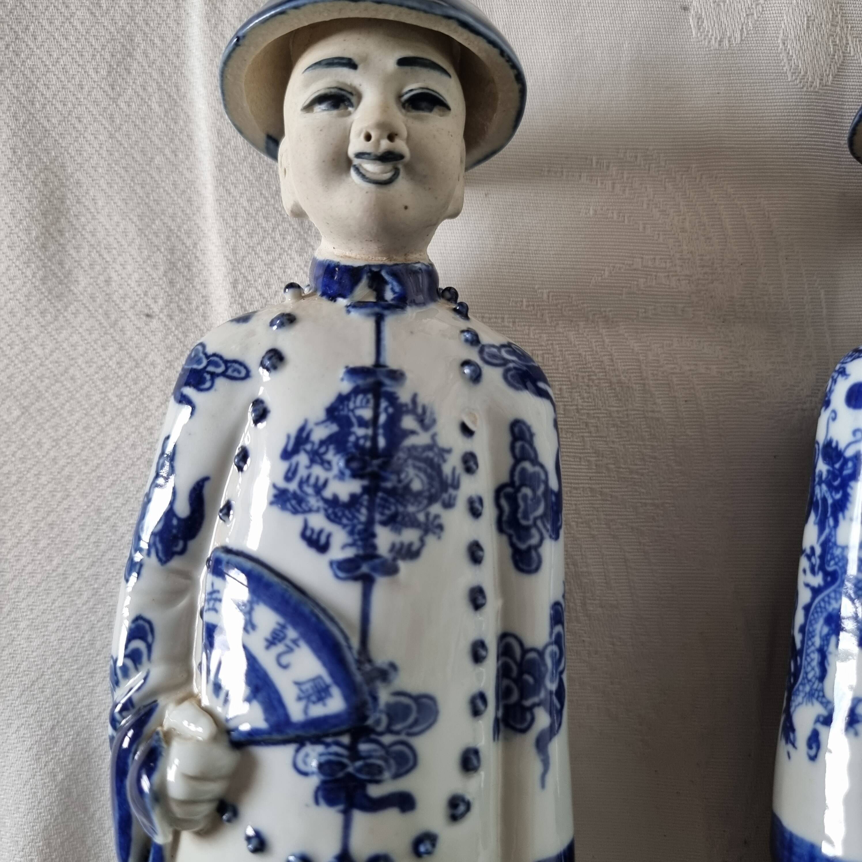 Pair of vintage Chinese blue and white porcelain figurines depicting