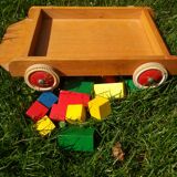 Wooden pull cart with its shapes to build