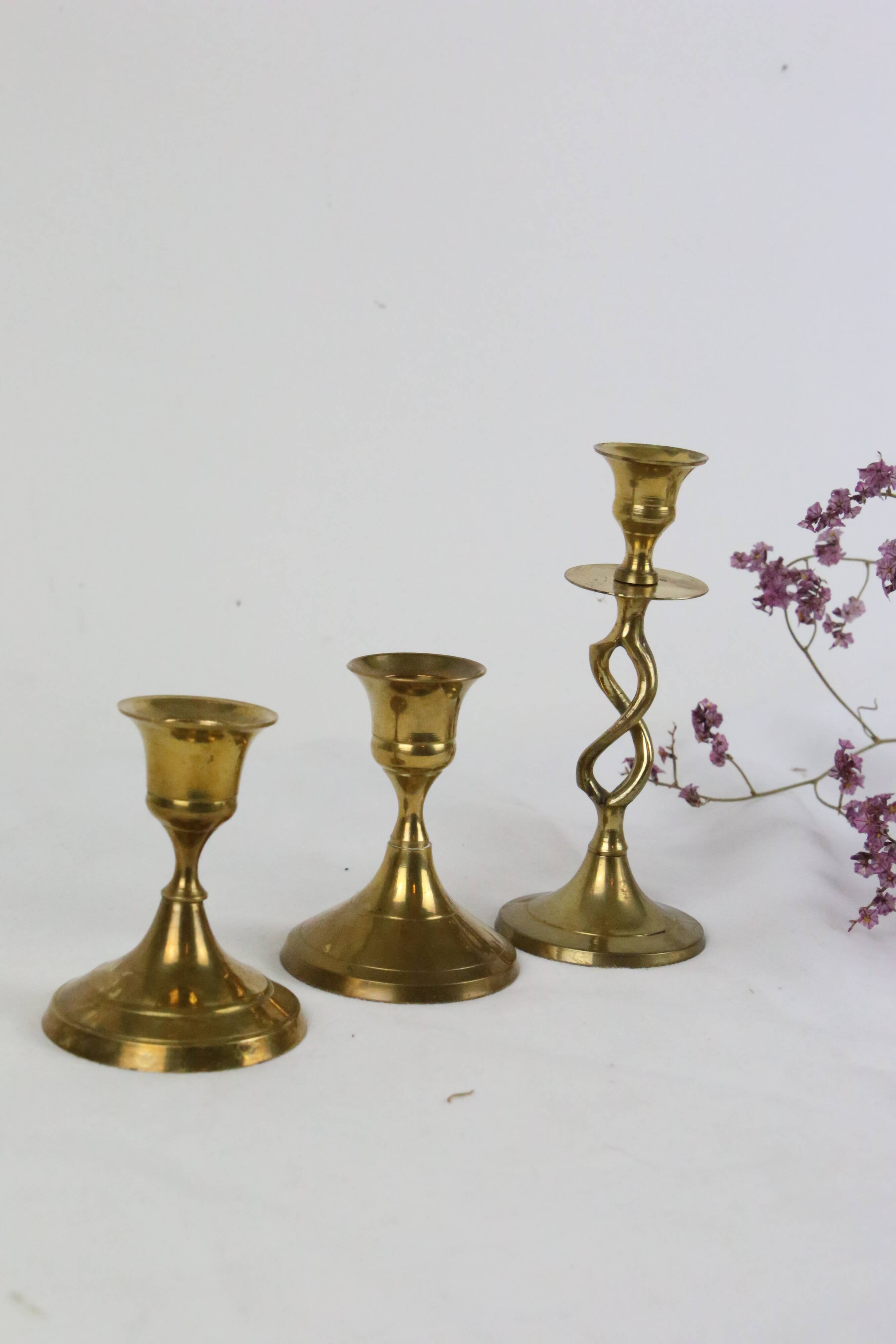 Trio of brass candle holders, vintage
