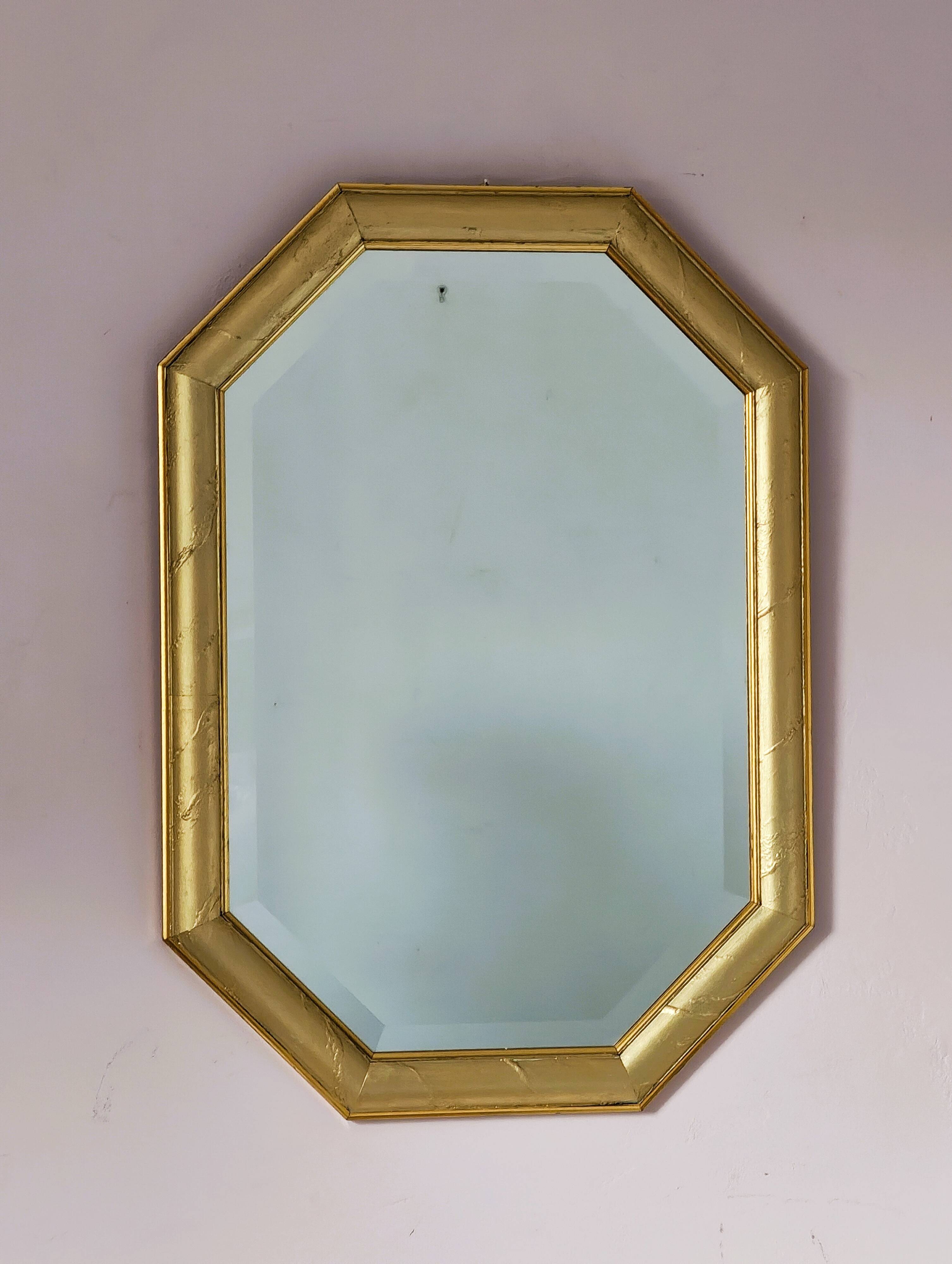 Golden octagonal mirror with bevelled glass from the 1970s.
