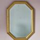Golden octagonal mirror with bevelled glass from the 1970s.
