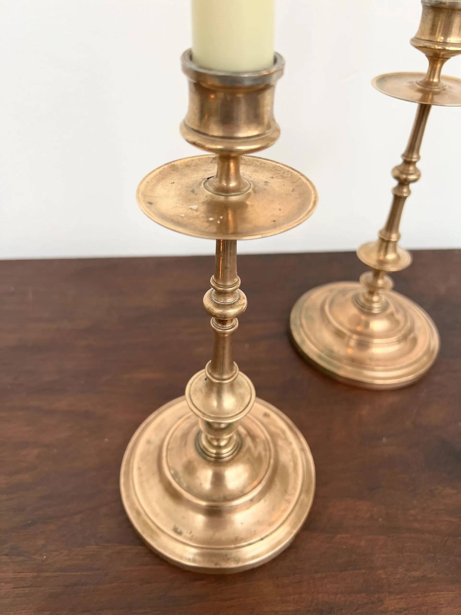 Pair of antique turned rose brass candlesticks (24 cm)