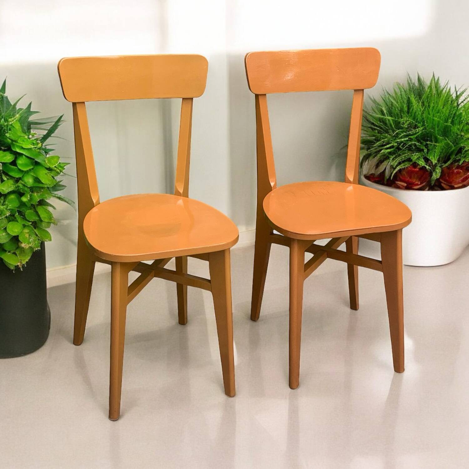 Pair of caramel bistro chairs 1950