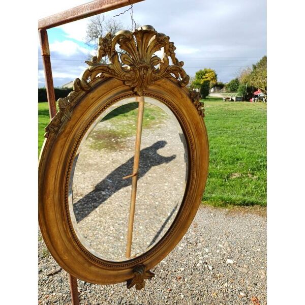 Miroir ovale en bois et stuc doré 19ème