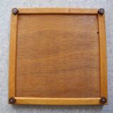 Dessous de plat ancien en faïence orange vintage