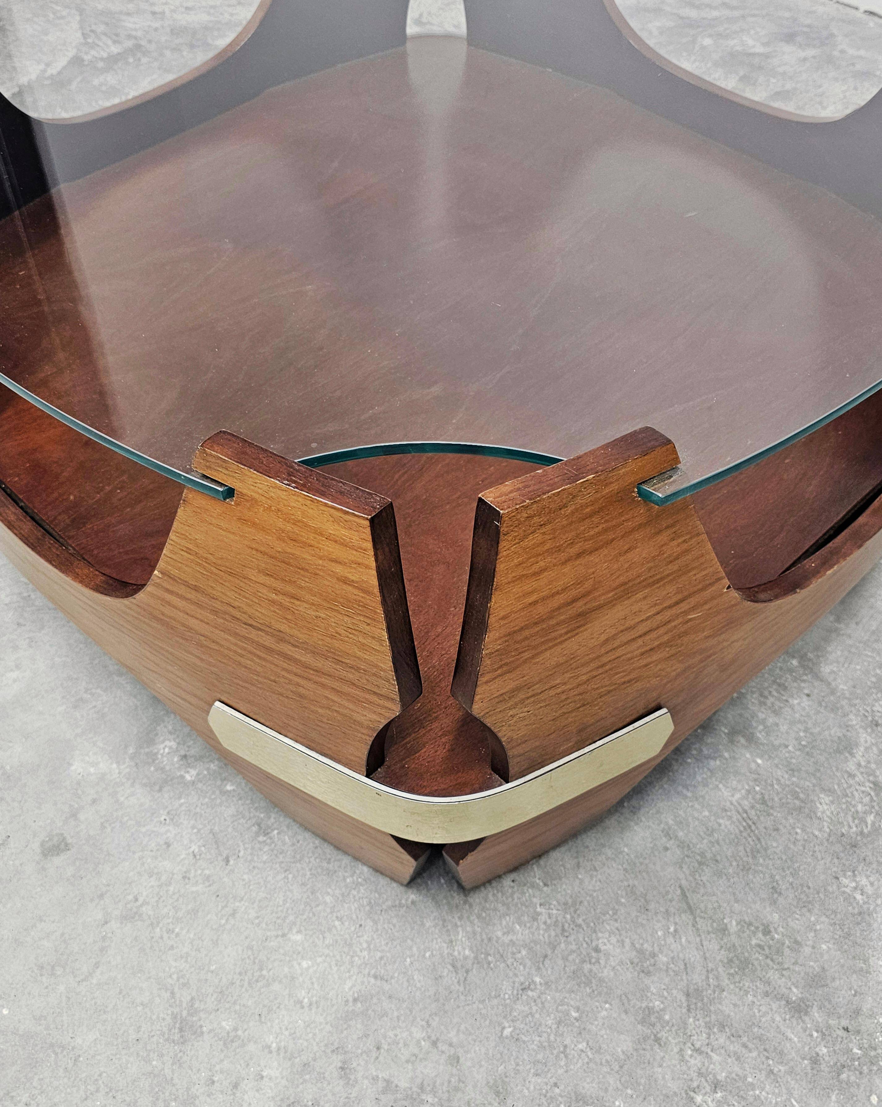 Mid-century coffee table in curved plywood with a glass top, 1940s.