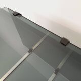 Vintage coffee table in smoked glass, black metal and cast aluminum