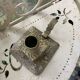Cellar rat candlestick in gilded brass chised flower pattern, foliage and old face