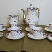 Service à café en porcelaine 18 pièces signé "Aux Lions de Faïence Paris"