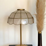 Table lamp with a vintage mother-of-pearl lampshade set and a golden foot