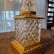 Pair of coloured table lamps, made of cut crystal and gilded bronze, in the Baccarat style.