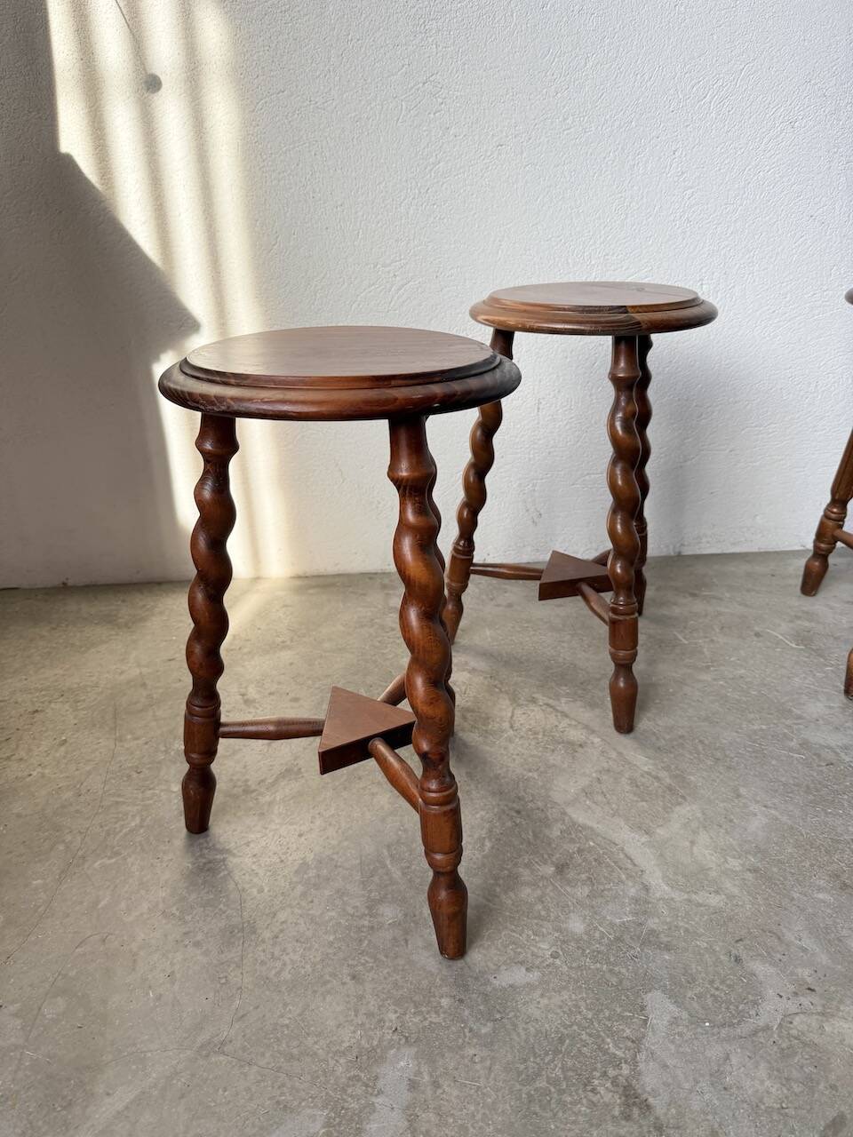 Set of 4 turned oak stools.