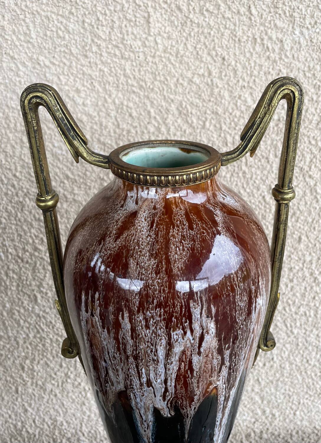 Two large stoneware vases with bronze fittings.