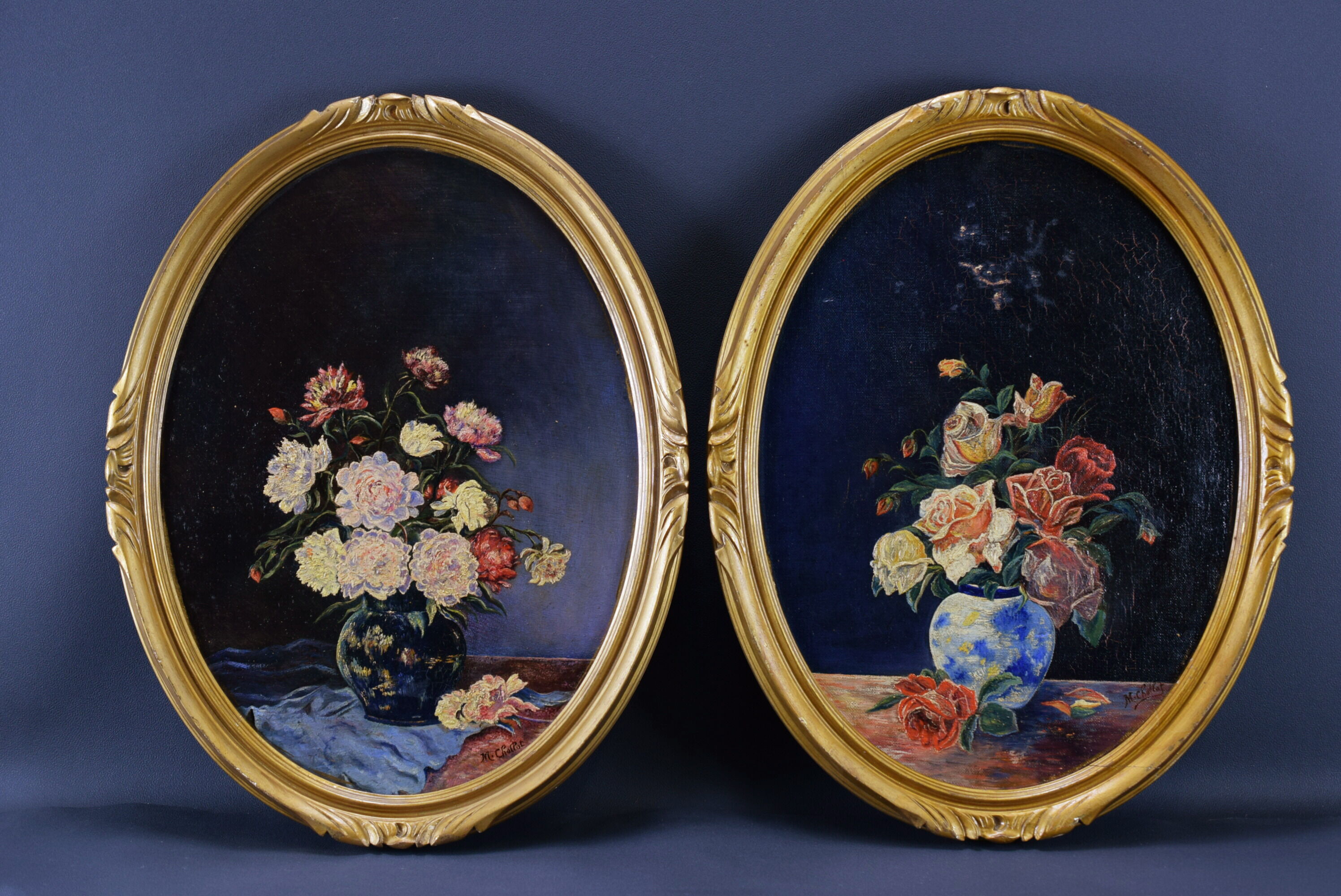 Pair of still life paintings bouquets oval golden frame