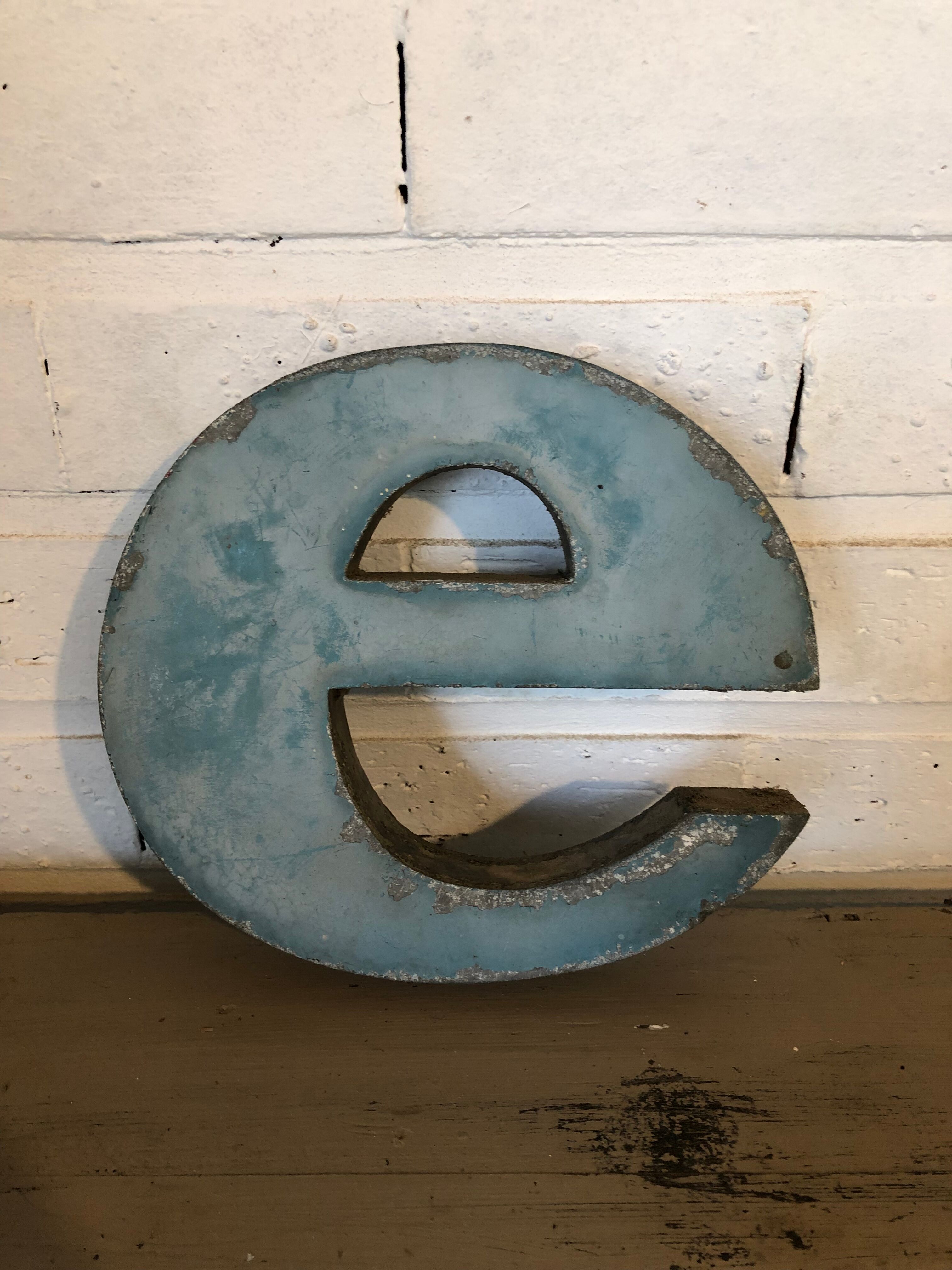 Blue sign letter "E"