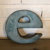Blue sign letter "E"