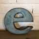 Blue sign letter "E"