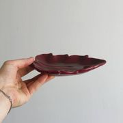Red ceramic butter dish with knife