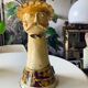 Terracotta plant holder head shape