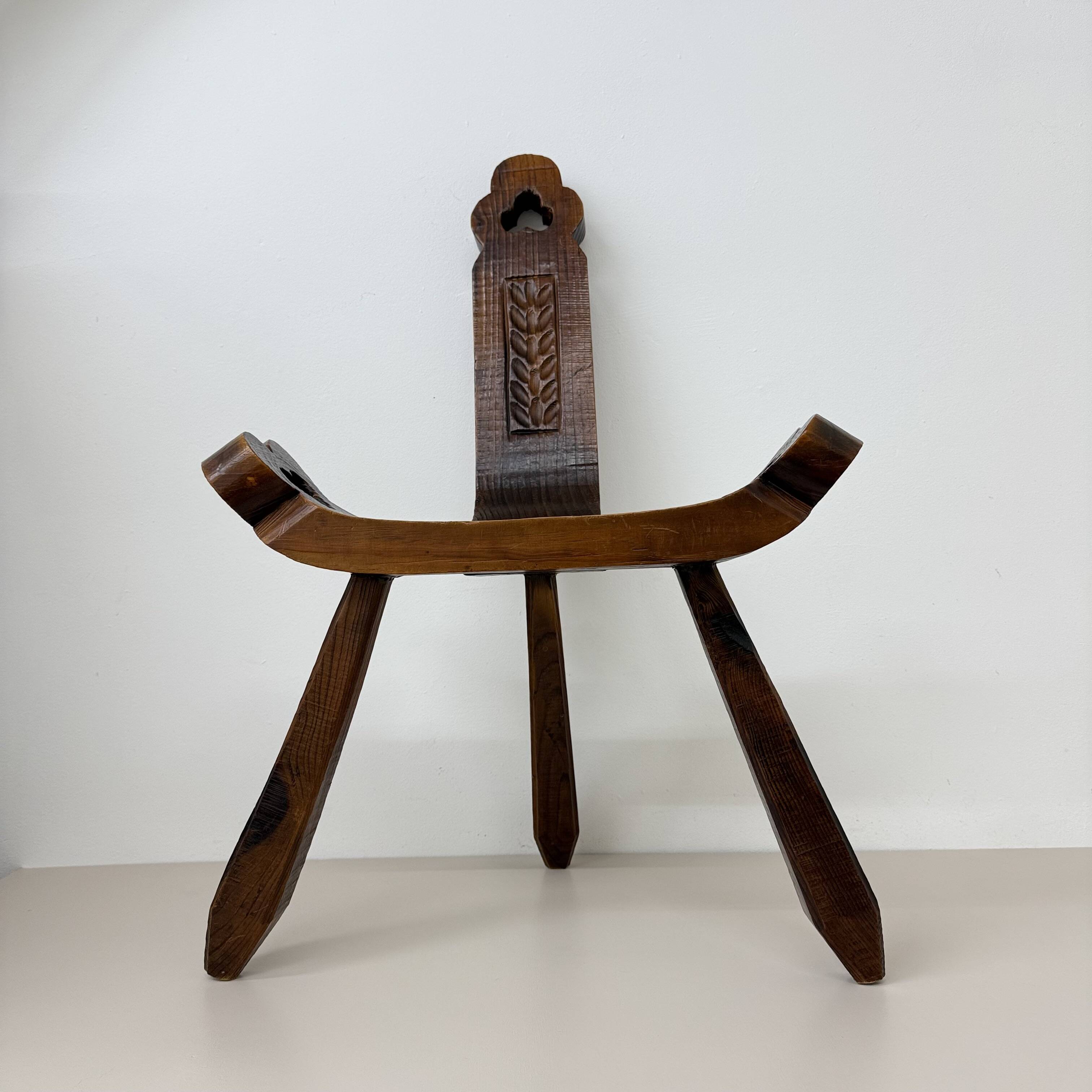 Brutalist hand carved oak Spanish tripod chair , 1970s
