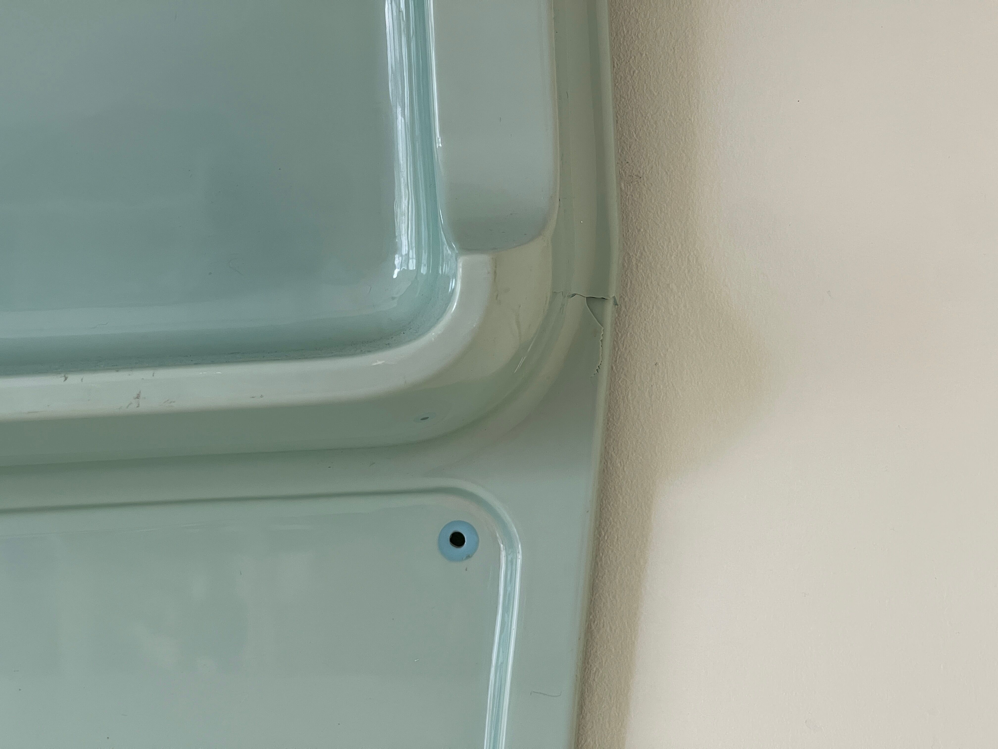 Baby blue plastic mirror and wash station