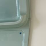 Baby blue plastic mirror and wash station